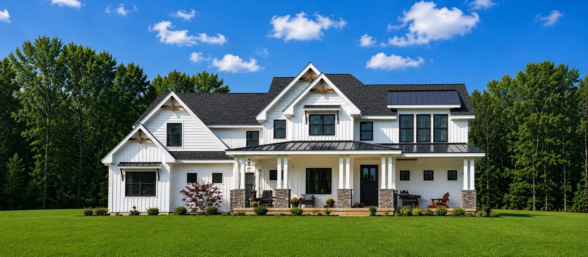 White board-and-batten farmhouse with a black roof and a wide front porch