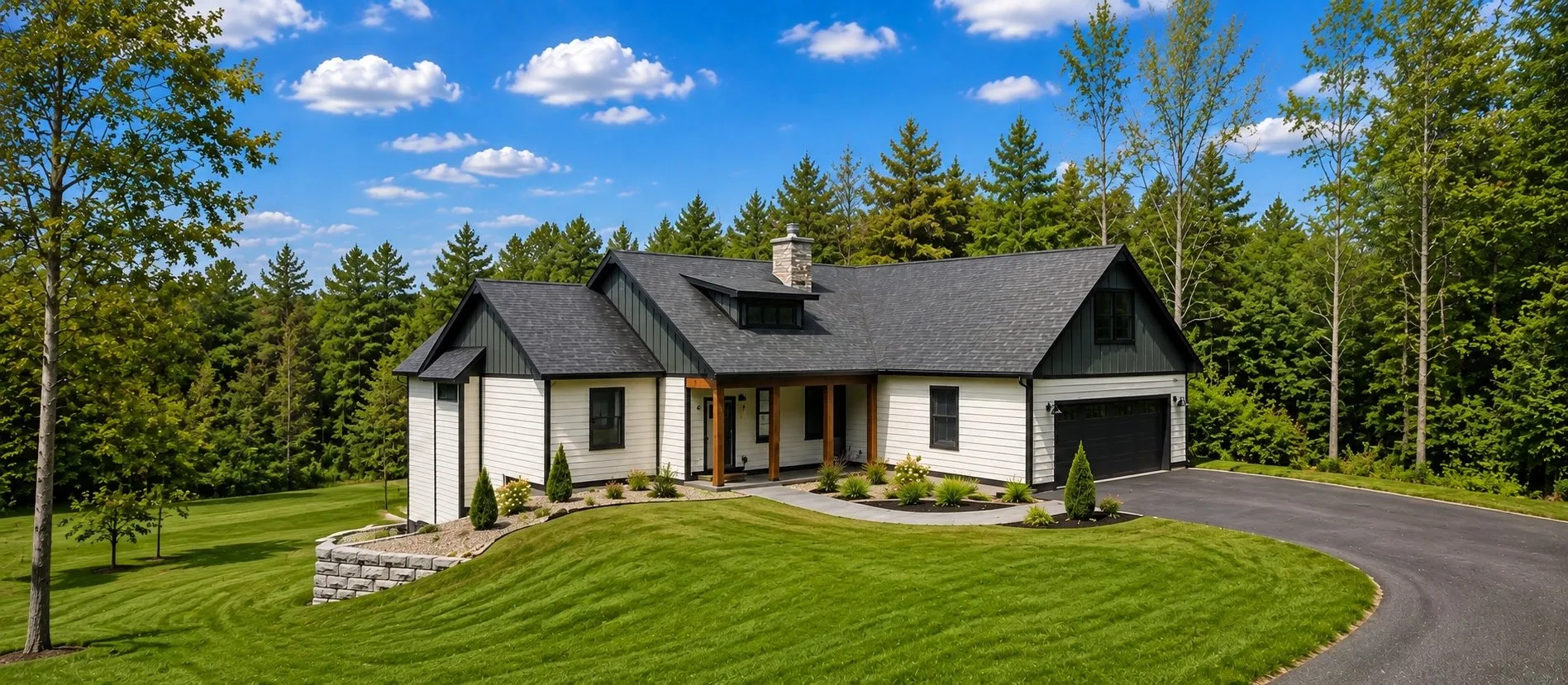 White ranch-style home with black trim and an attached garage